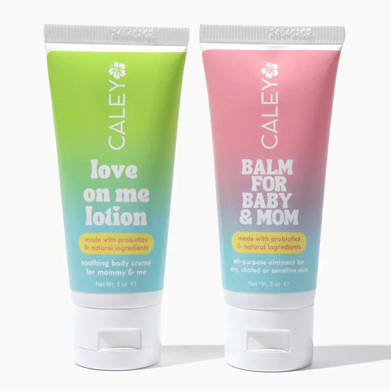 Probiotic baby lotion and balm in soft pastel packaging displayed on a clean white background, representing gentle non-toxic skincare for families.