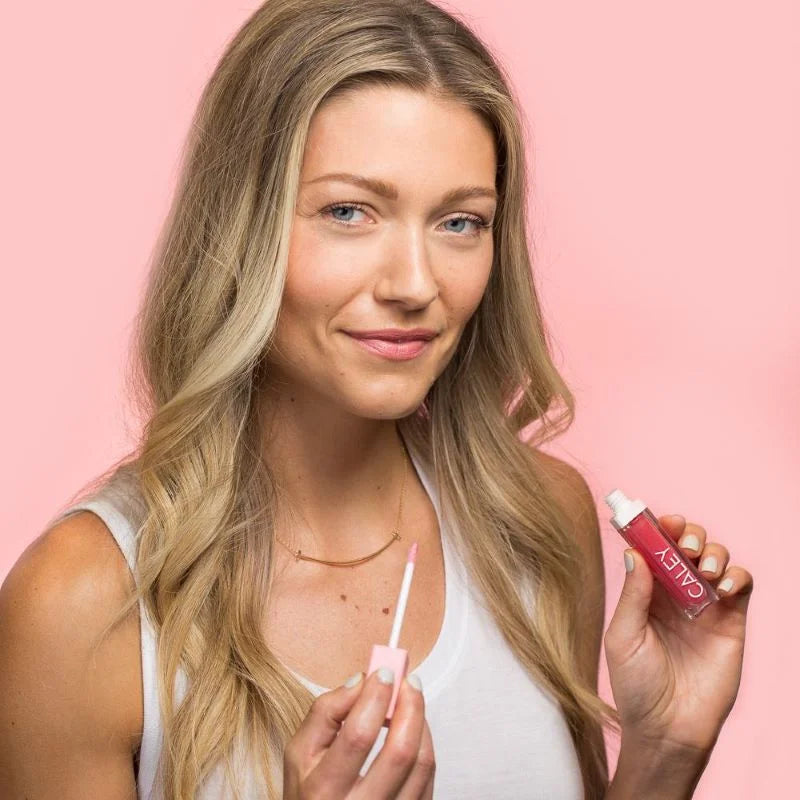 Enhance your natural beauty with Caley Cosmetics' Model with Beachy Kiss Natural Lip Oil Lip Gloss, featuring probiotic cosmetics for a radiant look. Discover the power of probiotics in your makeup routine.